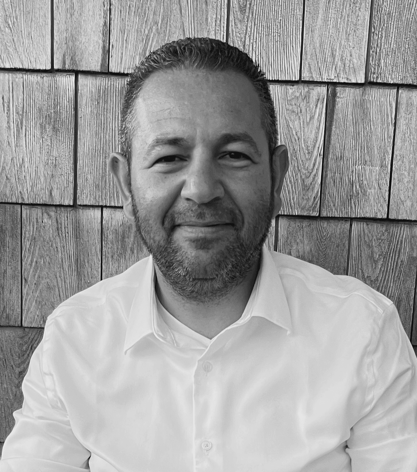 Mustafa Sualp, founder of Sociail, in a black-and-white portrait.